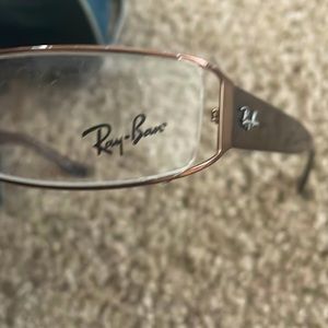 These Ray-ban glasses have never been wore an the temples are a brownish color